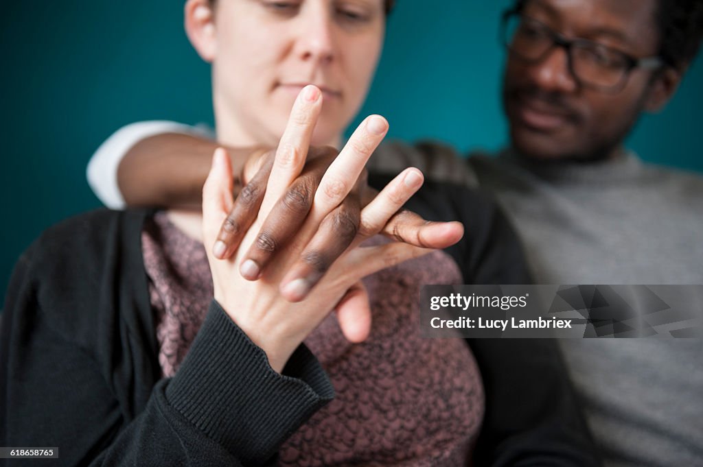 Woman and man mixing fingers