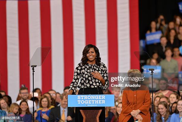 Democratic presidential candidate Hillary Clinton and US First Lady Michelle Obama are seen during a presidential campaign event in Winston-Salem,...