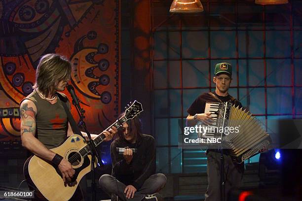 Episode 2420 -- Pictured: Musical guests John Rzeznik, Robby Takac, and Mike Malinin of the Goo Goo Dolls perform on January 30, 2003 --