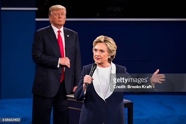 Republican presidential nominee Donald Trump listens as Democratic presidential nominee former Secretary of State Hillary Clinton speaks during the...