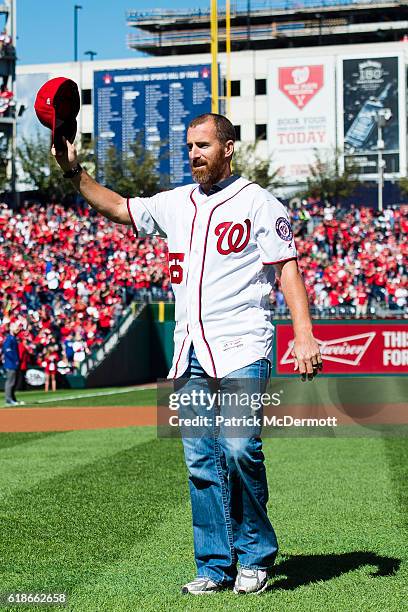 Former MLB player Adam LaRoche waves to the crowd after throwing out the ceremonial first pitch prior to game two of the National League Division...