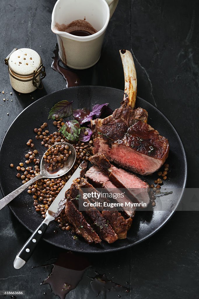 Tomahawk beef steak with lentil