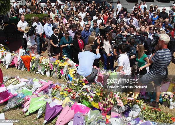 Staff members gather after a private memorial was held at Dreamworld on October 28, 2016 in Gold Coast, Australia. Four people were killed following...