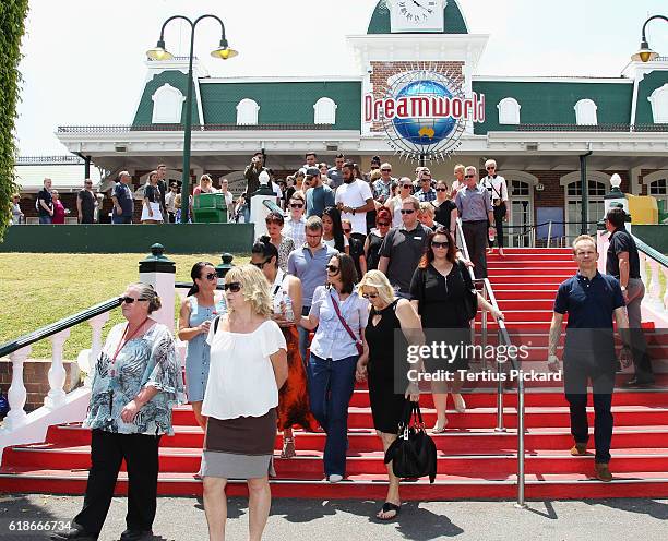 Staff members gather after a private memorial was held at Dreamworld on October 28, 2016 in Gold Coast, Australia. Four people were killed following...