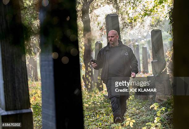 "Paranormal Investigator" Willi Gabler from Vienna Ghosthunters looks for paranormal activity at Vienna Central Cemetery on October 20, 2016. The...