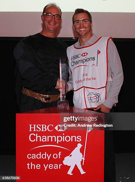 Austin Johnson is presented with his Caddy of the Year Award by HSBC's Giles Morgan after the first round of the WGC - HSBC Champions at the Sheshan...