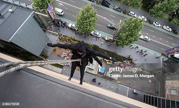 An abseiling spider descends the outside wall at the Australian Museum on October 28, 2016 in Sydney, Australia. The event was to celebrate the...