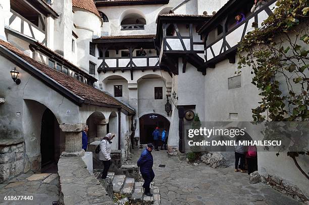 Partial view of interior court of the Bran Castle is pictured in Bran, Romania on October 18, 2016. Armed with courage and hopefully garlic, two...