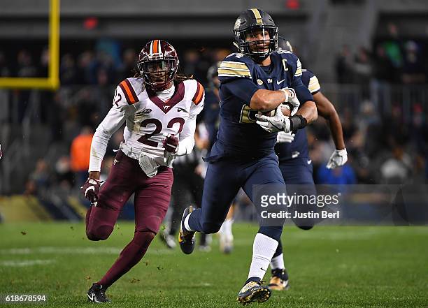 James Conner of the Pittsburgh Panthers rushes against Terrell Edmunds of the Virginia Tech Hokies in the second half during the game at Heinz Field...