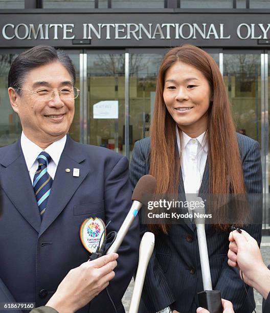 Switzerland - Masato Mizuno , the CEO of the Tokyo 2020 Bid Committee, and Olympic silver medal-winning soccer player Homare Sawa , meet the press in...