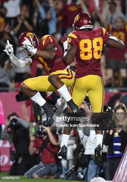 Daniel Imatorbhebhe celebrates with USC Darreus Rogers after catching a pass for a touchdown in the third quarter during an NCAA football game...