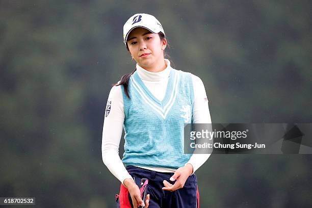 Kotone Hori of Japan reacts after a putt on the 18th green during the first round of the Higuchi Hisako Ponta Ladies at the Musashigaoka Golf Course...