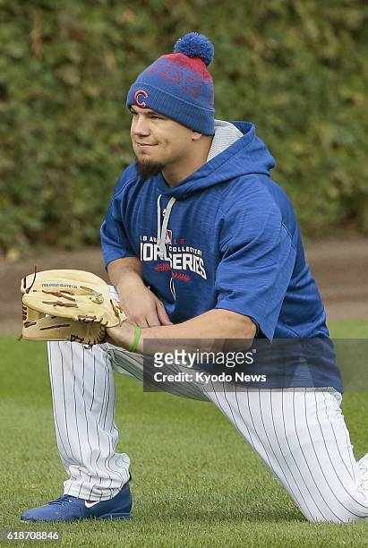 Chicago Cubs outfielder Kyle Schwarber joins a training session in Chicago on Oct. 27 a day before the World Series Game 3 against the Cleveland...