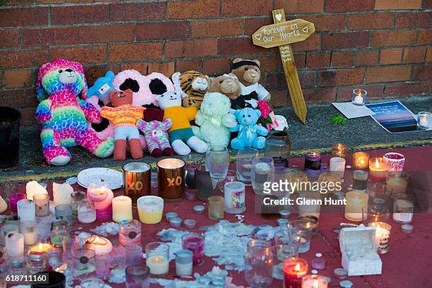 Mourners attend a candlelight vigil outside Dreamworld on October 28, 2016 in Gold Coast, Australia. Four people were killed following an accident on...