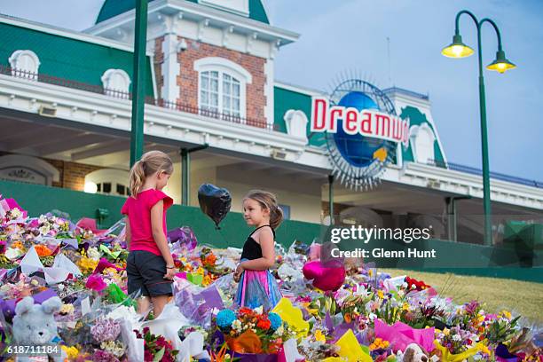 Mourners attend a candlelight vigil outside Dreamworld on October 28, 2016 in Gold Coast, Australia. Four people were killed following an accident on...