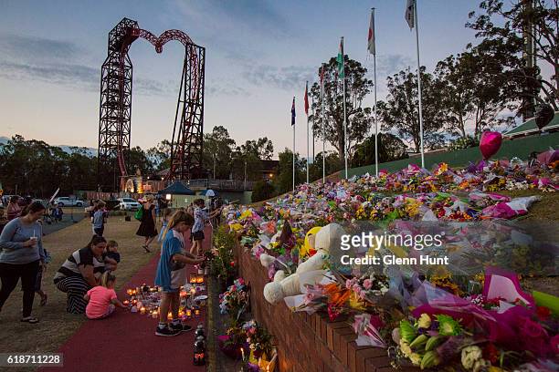 Mourners attend a candlelight vigil outside Dreamworld on October 28, 2016 in Gold Coast, Australia. Four people were killed following an accident on...
