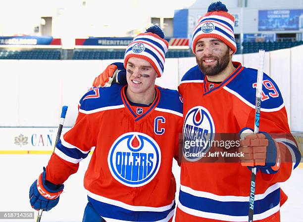 Connor McDavid and Patrick Maroon of the Edmonton Oilers pose together after practice for the 2016 Tim Hortons NHL Heritage Classic to be played...