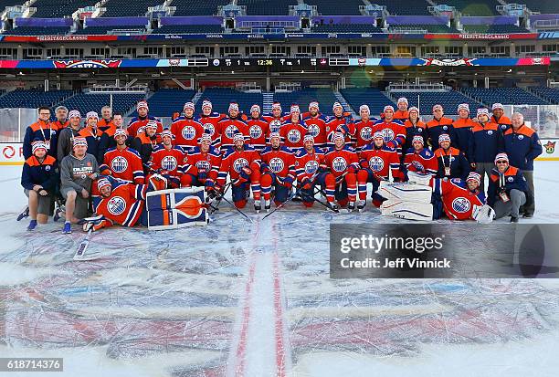 The Edmonton Oilers pose for a group picture at centre ice after practice for the 2016 Tim Hortons NHL Heritage Classic to be played against the...