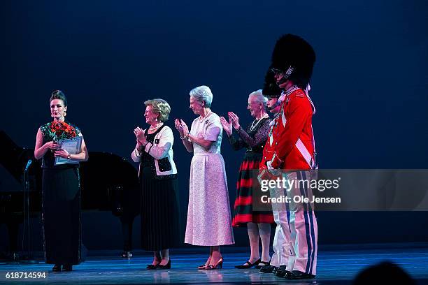 Danish Queen Margrethe and her sisters, Princess Bennedikte and Queen Anne-Marie of Greece gratulate young jazz singer Sinne Eeg after presenting...