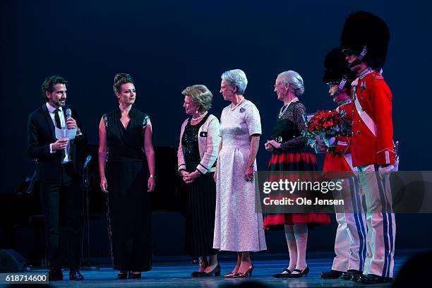 Danish Queen Margrethe and her sisters, Princess Bennedikte and Queen Anne-Marie of Greece gratulate young jazz singer Sinne Eeg after presenting...