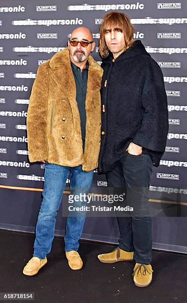 Paul Bonehead Arthurs and Liam Gallagher attend the 'Oasis: Supersonic' German Premiere In Berlin on October 27, 2016 in Berlin, Germany.