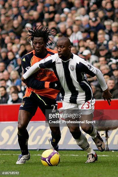 Benjani Mwaruwari of Manchester City battles for the ball with Abdoulaye Meite of West Bromwich Albion during the Barclays Premier League match...