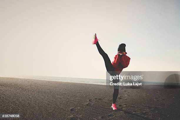 kick boxing on the beach - judo female stock pictures, royalty-free photos & images