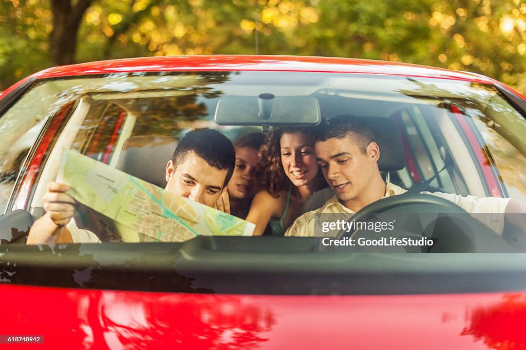 Friends in car going on vacation