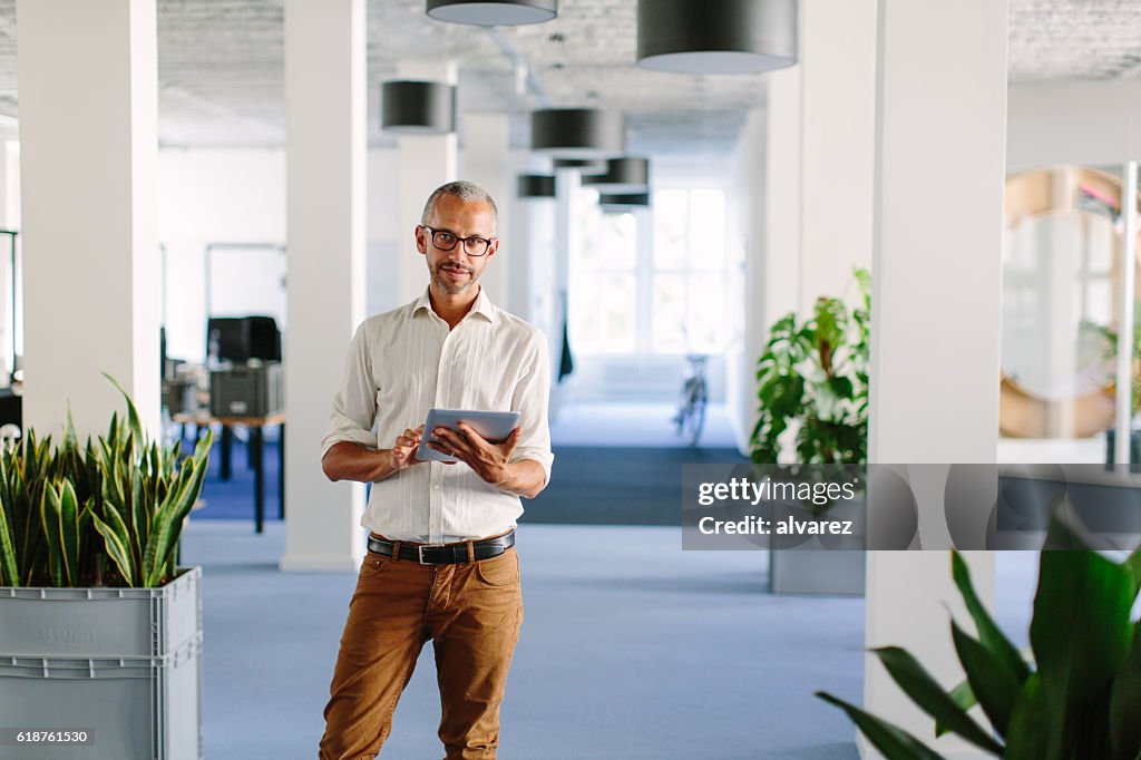 Confident mature businessman at startup