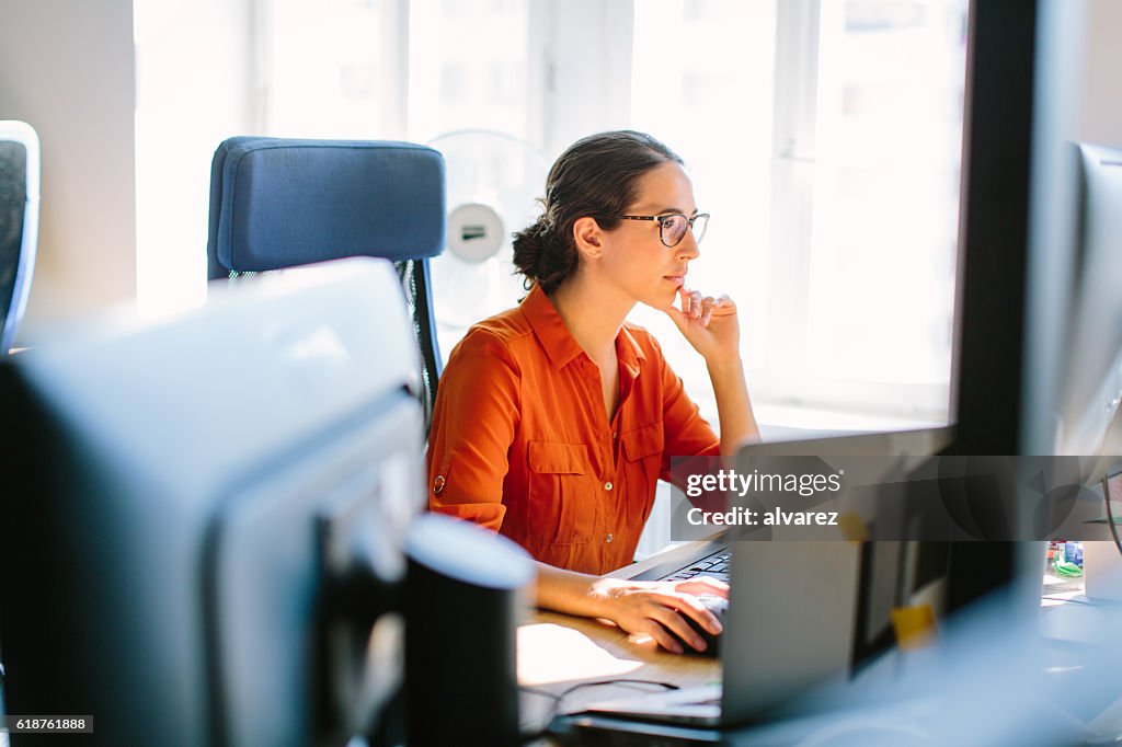 Business woman working at her desk