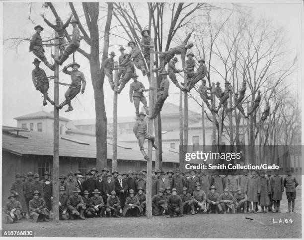 Students and instructors of a Pole-Climbing course for telephone electricians during Student Army Training Corps vocational training at the...