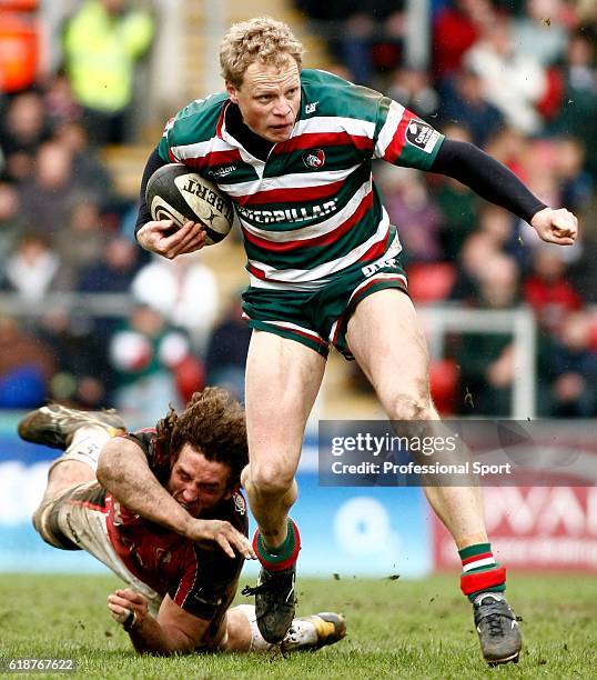 Scott Hamilton of Leicester evades Jacques Burger of Saracens during the Guinness Premiership match between Leicester Tigers and Saracens at Welford...