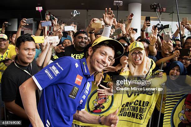Valentino Rossi of Italy and Movistar Yamaha MotoGP poses for fans during the autograph session during the MotoGP Of Malaysia - Free Practice at...