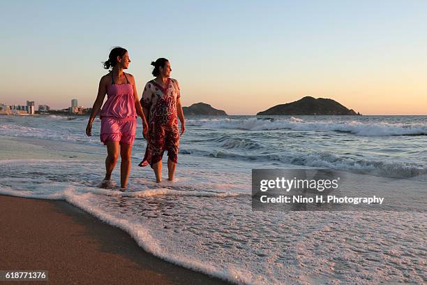 friends on the beach - mazatlan stock-fotos und bilder