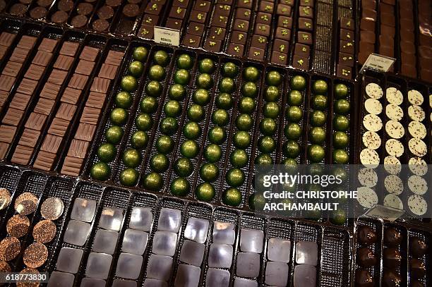 Different types of chocolate are displayed at the Salon du Chocolat in Paris on October 28, 2016. / AFP / CHRISTOPHE ARCHAMBAULT