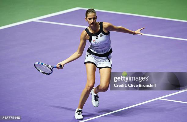 Karolina Pliskova of Czech Republic plays a forehand in her singles match against Agnieszka Radwanska of Poland during day 6 of the BNP Paribas WTA...