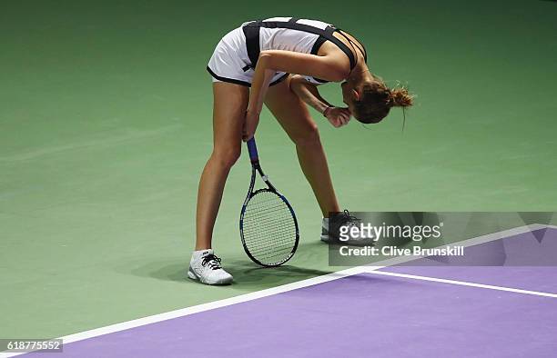 Karolina Pliskova of Czech Republic reacts in her singles match against Agnieszka Radwanska of Poland during day 6 of the BNP Paribas WTA Finals...