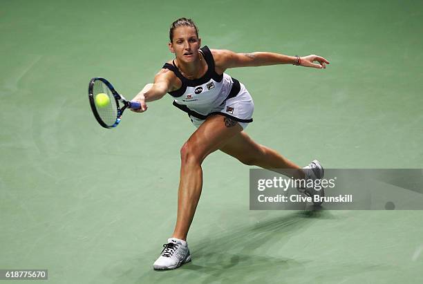 Karolina Pliskova of Czech Republic stretches for a forehand in her singles match against Agnieszka Radwanska of Poland during day 6 of the BNP...