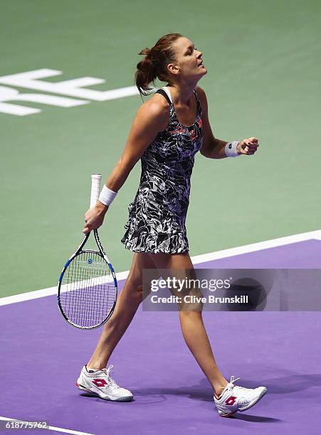 Agnieszka Radwanska of Poland celebrates victory in her singles match against Karolina Pliskova of Czech Republic during day 6 of the BNP Paribas WTA...