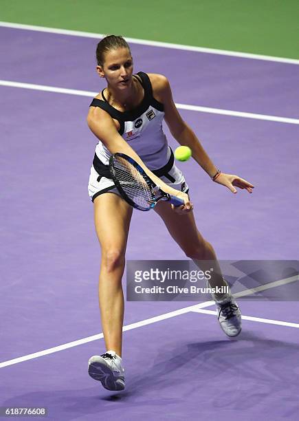 Karolina Pliskova of Czech Republic volleys in her singles match against Agnieszka Radwanska of Poland during day 6 of the BNP Paribas WTA Finals...