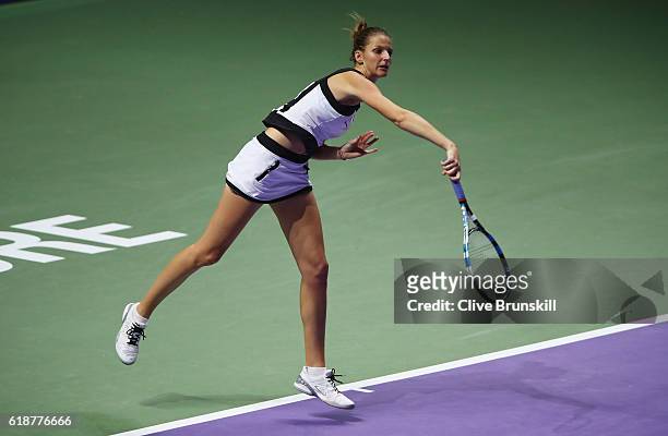 Karolina Pliskova of Czech Republic serves in her singles match against Agnieszka Radwanska of Poland during day 6 of the BNP Paribas WTA Finals...