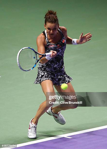 Agnieszka Radwanska of Poland plays a forehand in her singles match against Karolina Pliskova of Czech Republic during day 6 of the BNP Paribas WTA...