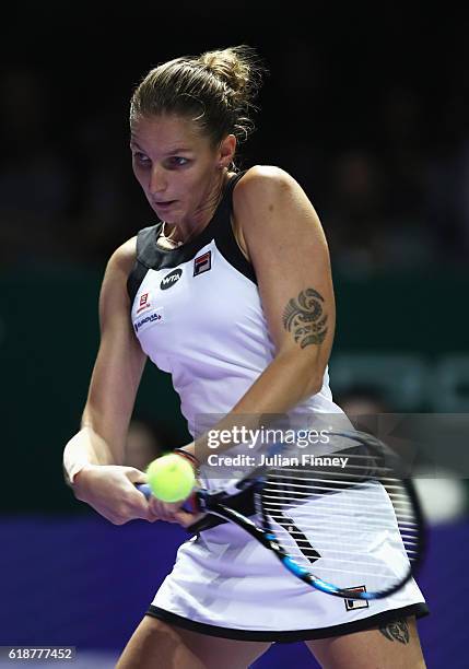 Karolina Pliskova of Czech Republic plays a backhand in her singles match against Agnieszka Radwanska of Poland during day 6 of the BNP Paribas WTA...