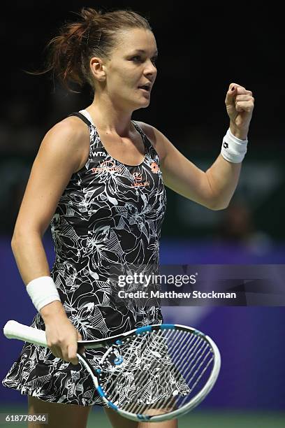 Agnieszka Radwanska of Poland celebrates victory in her singles match against Karolina Pliskova of Czech Republic during day 6 of the BNP Paribas WTA...