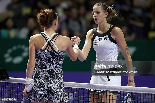 Karolina Pliskova of Czech Republic congratulates Agnieszka Radwanska of Poland after their singles match during day 6 of the BNP Paribas WTA Finals...