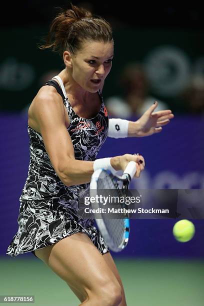 Agnieszka Radwanska of Poland plays a forehand in her singles match against Karolina Pliskova of Czech Republic during day 6 of the BNP Paribas WTA...