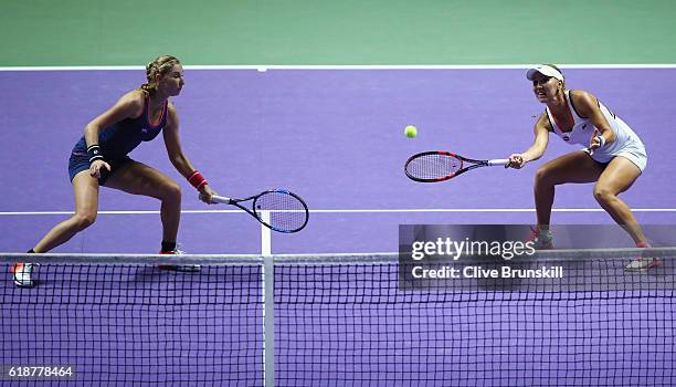 Elena Vesnina and Ekaterina Makarova of Russia in action in their doubles match against Andrea Hlavackova and Lucie Hradecka of Czech Republic during...