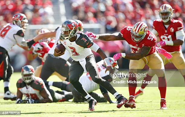 Jameis Winston of the Tampa Bay Buccaneers breaks away from Ahmad Brooks of the San Francisco 49ers during the game at Levi Stadium on October 23,...