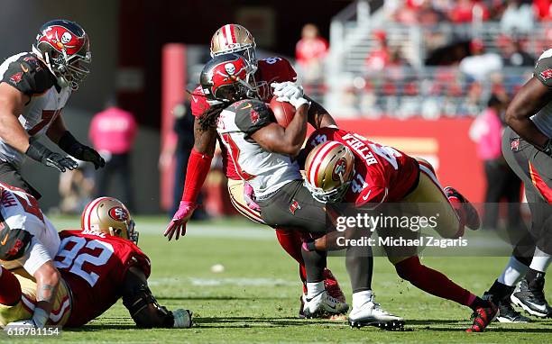 Antoine Bethea of the San Francisco 49ers tackles Jacquizz Rodgers of the Tampa Bay Buccaneers during the game at Levi Stadium on October 23, 2016 in...