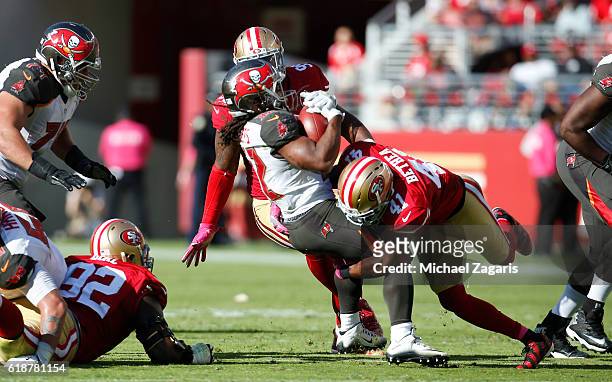 Antoine Bethea of the San Francisco 49ers tackles Jacquizz Rodgers of the Tampa Bay Buccaneers during the game at Levi Stadium on October 23, 2016 in...